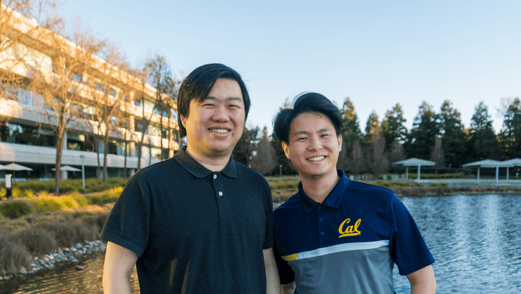 Founding mentors Jerry Li and Daniel Huang outdoors by a lake