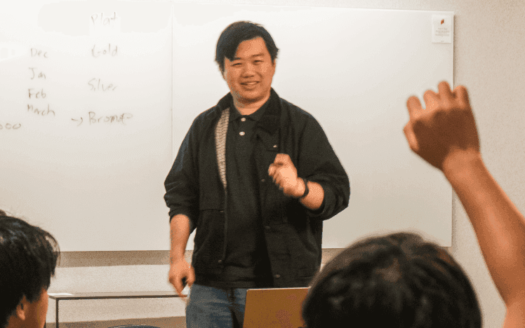 Jerry teaching a class at the whiteboard