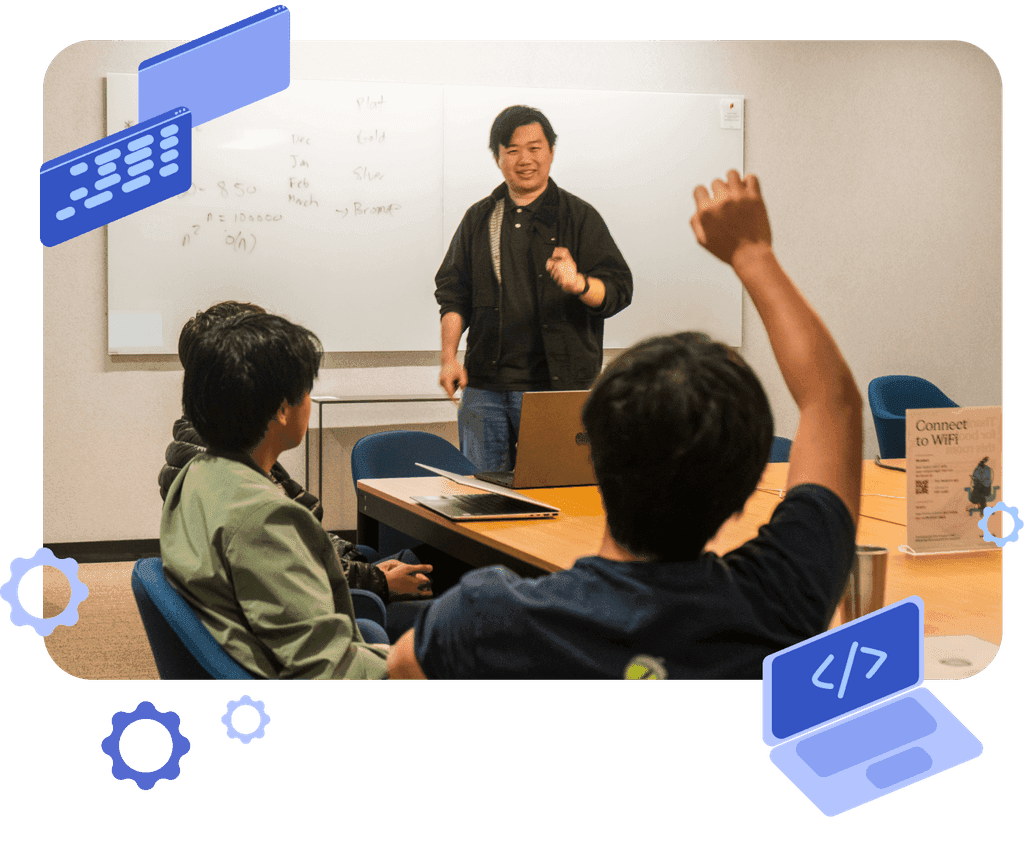 Coach Jerry Li teaching a small group of students around a table